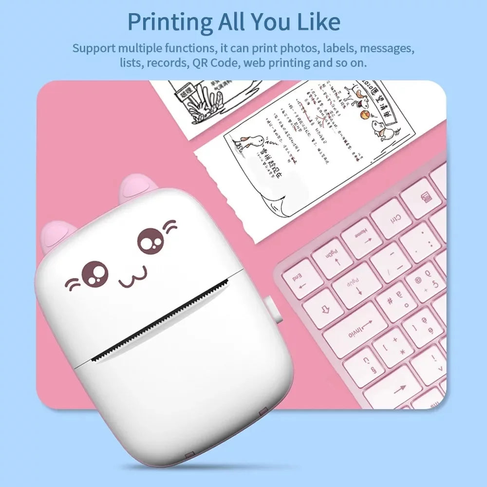Cute printer with cartoon face on a pink keyboard and mouse pad