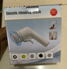 Box of an electric cleaning brush with various attachments on a beige background