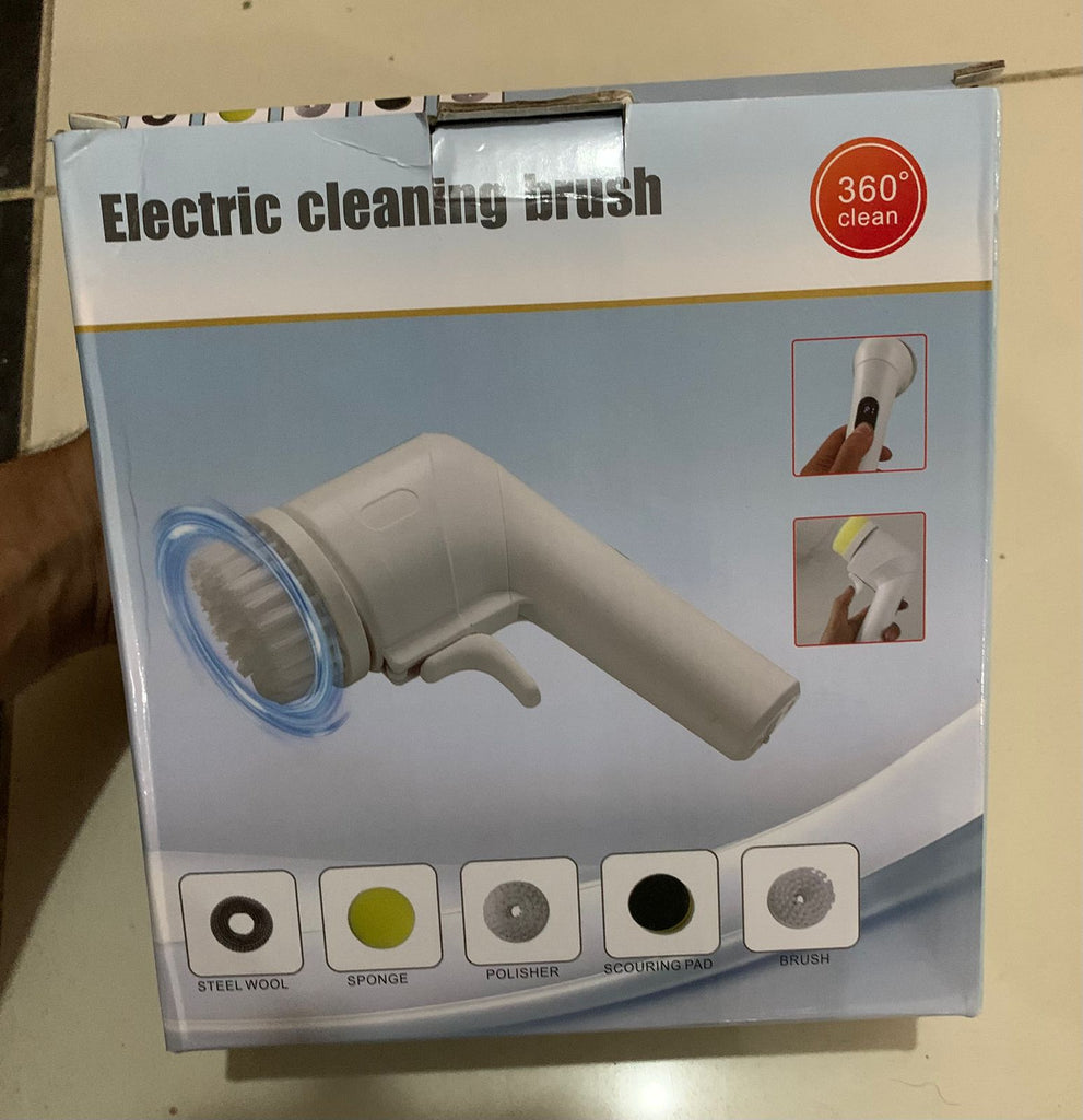 Box of an electric cleaning brush with various attachments on a beige background