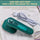 Green handheld garment iron on a white surface with text about its portability.