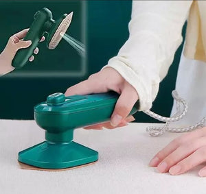 Person using a green handheld sander on a white surface with a close-up inset showing the tool's head.
