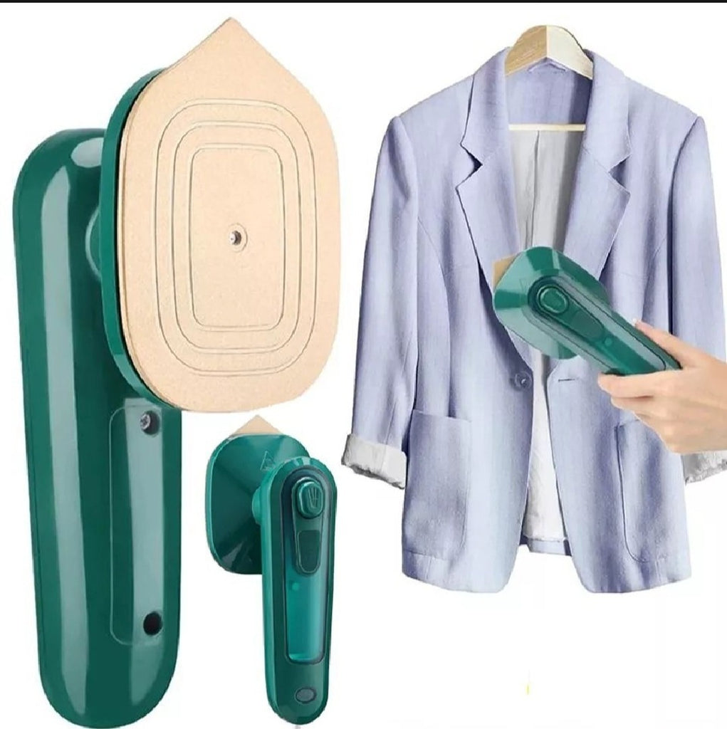 Green handheld steamer with beige ironing board attachment next to a light blue jacket.