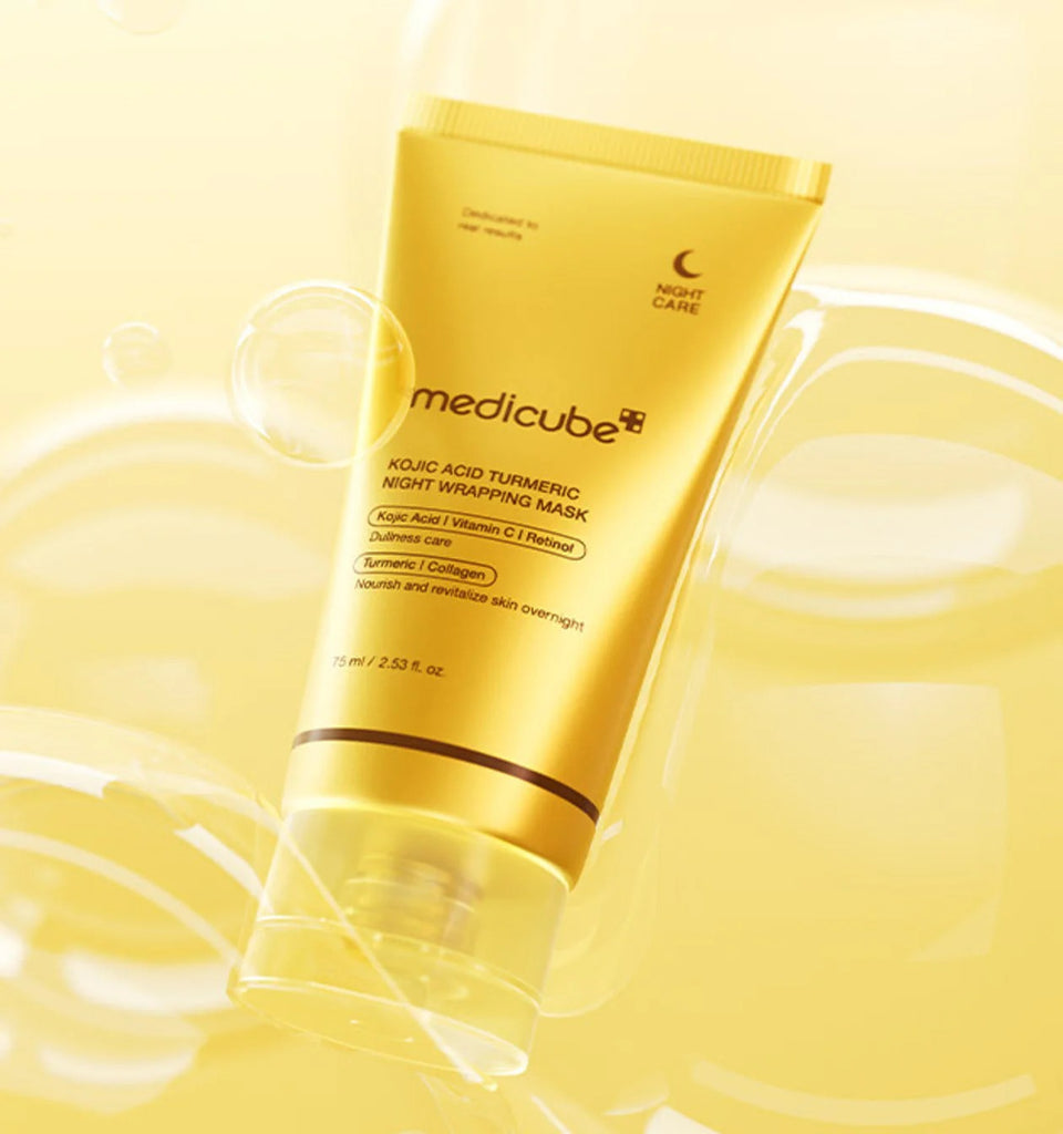 Medicube Kojic Acid Turmeric Night Wrapping Mask tube on a yellow background