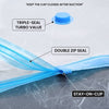 Blue inflatable water balloon with labeled features including triple-seal turbo value, double zip seal, and stay-on-clip, shown on a white and gray background.